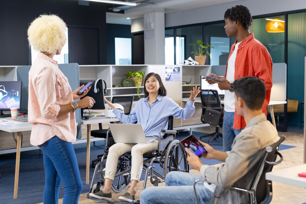 Diverse group of people using accessible technology and digital interfaces